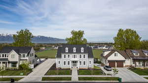 Aerial view of residential area featuring a mountainous background