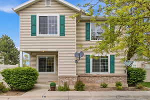 View of front of property featuring brick siding