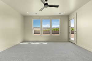 Unfurnished room with light carpet, a ceiling fan, plenty of natural light, and recessed lighting
