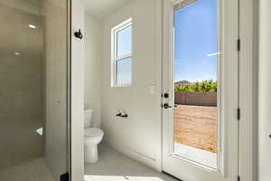 Full bathroom featuring a stall shower and light tile patterned flooring