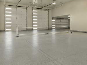 Garage featuring baseboards
