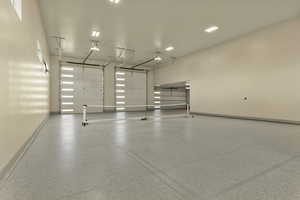Garage featuring baseboards