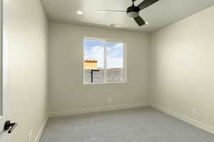Unfurnished room with light carpet, a ceiling fan, and recessed lighting