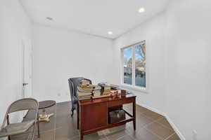 Office area featuring recessed lighting and dark tile patterned flooring