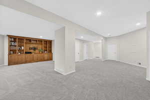 Below grade area with carpet floors and recessed lighting
