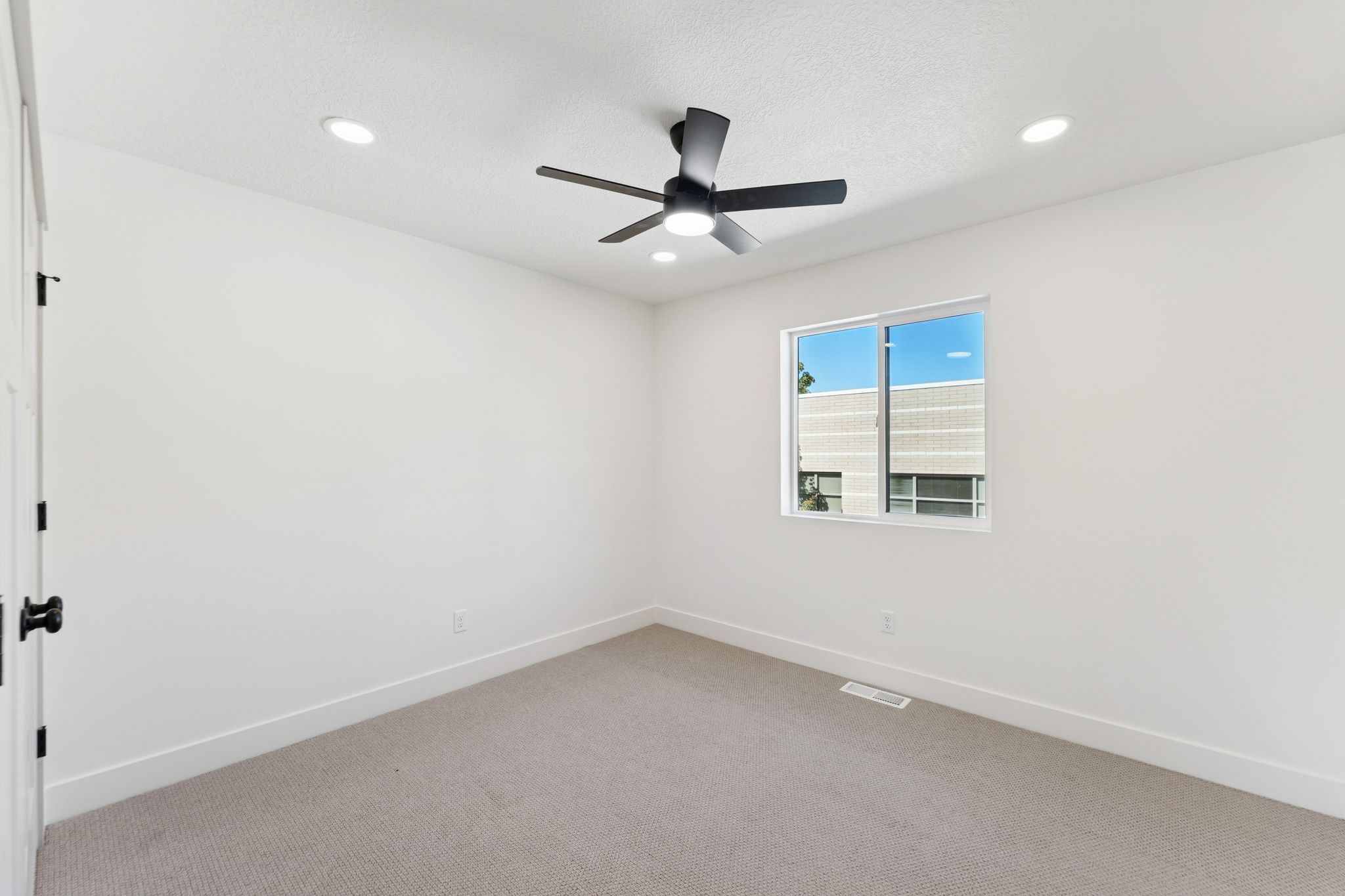 Unfurnished room with light carpet, recessed lighting, and a ceiling fan
