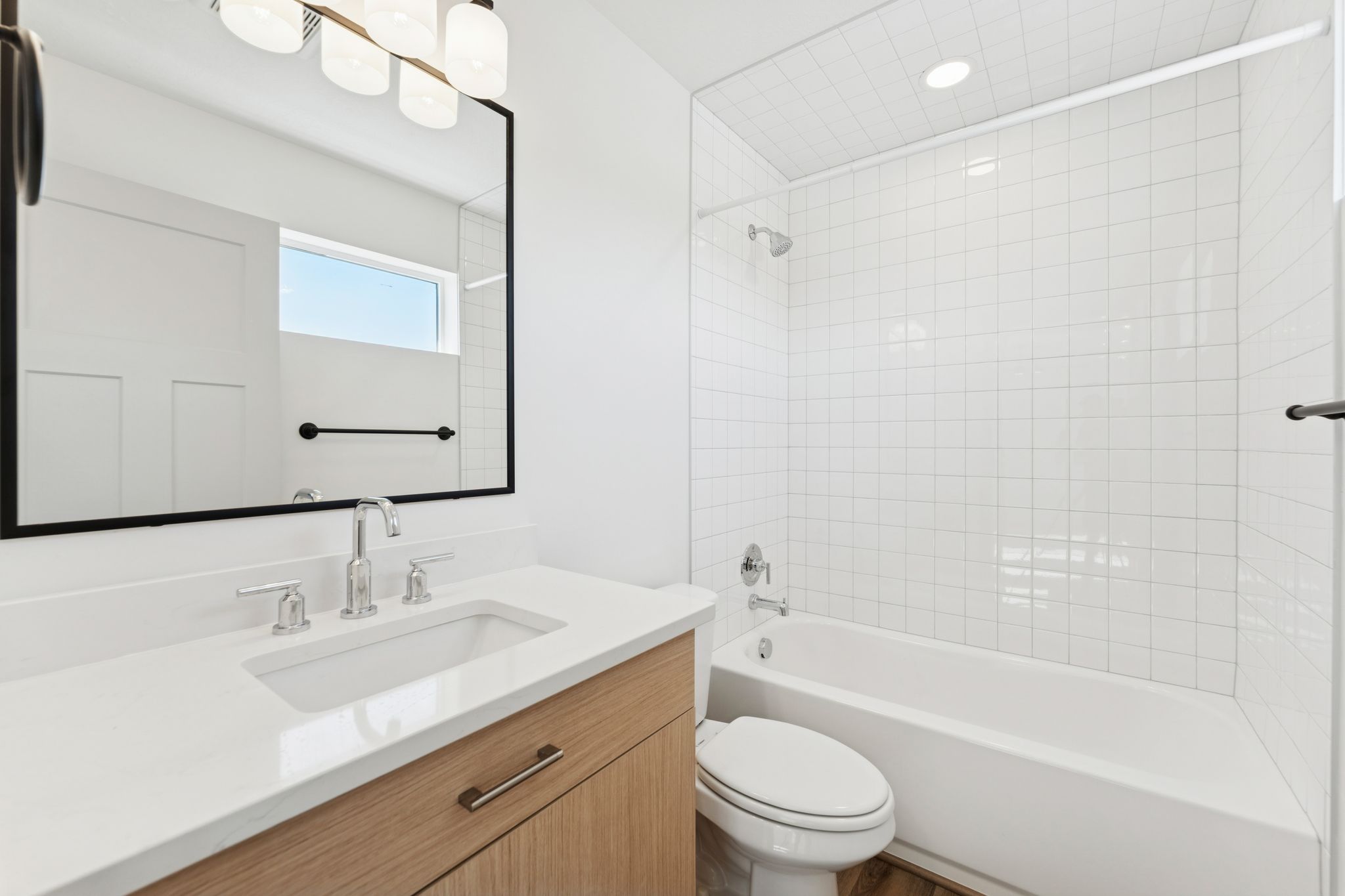 Bathroom with vanity and bathtub / shower combination