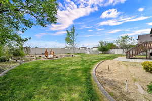 Fenced backyard featuring a patio area