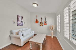 Living room with hardwood / wood-style flooring