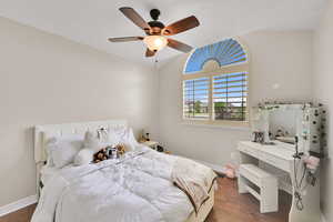Bedroom featuring dark wood finished floors and ceiling fan