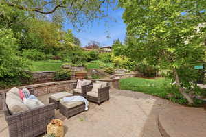 View of patio with an outdoor hangout area