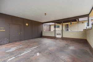 View of Covered Carport and Storage.