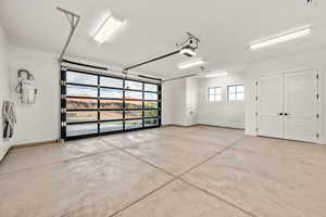 Garage featuring french doors and a garage door opener