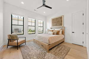 Bedroom featuring light wood finished floors, recessed lighting, and a ceiling fan