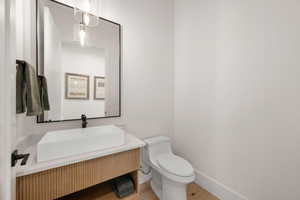 Bathroom featuring vanity and light wood finished floors