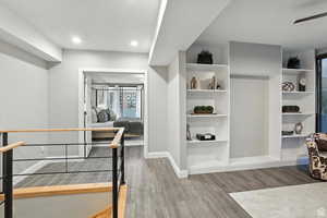 Top of stairs leading to an open office space