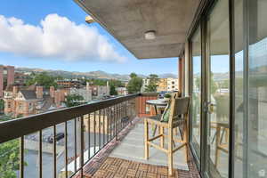 Balcony featuring an east mountain view