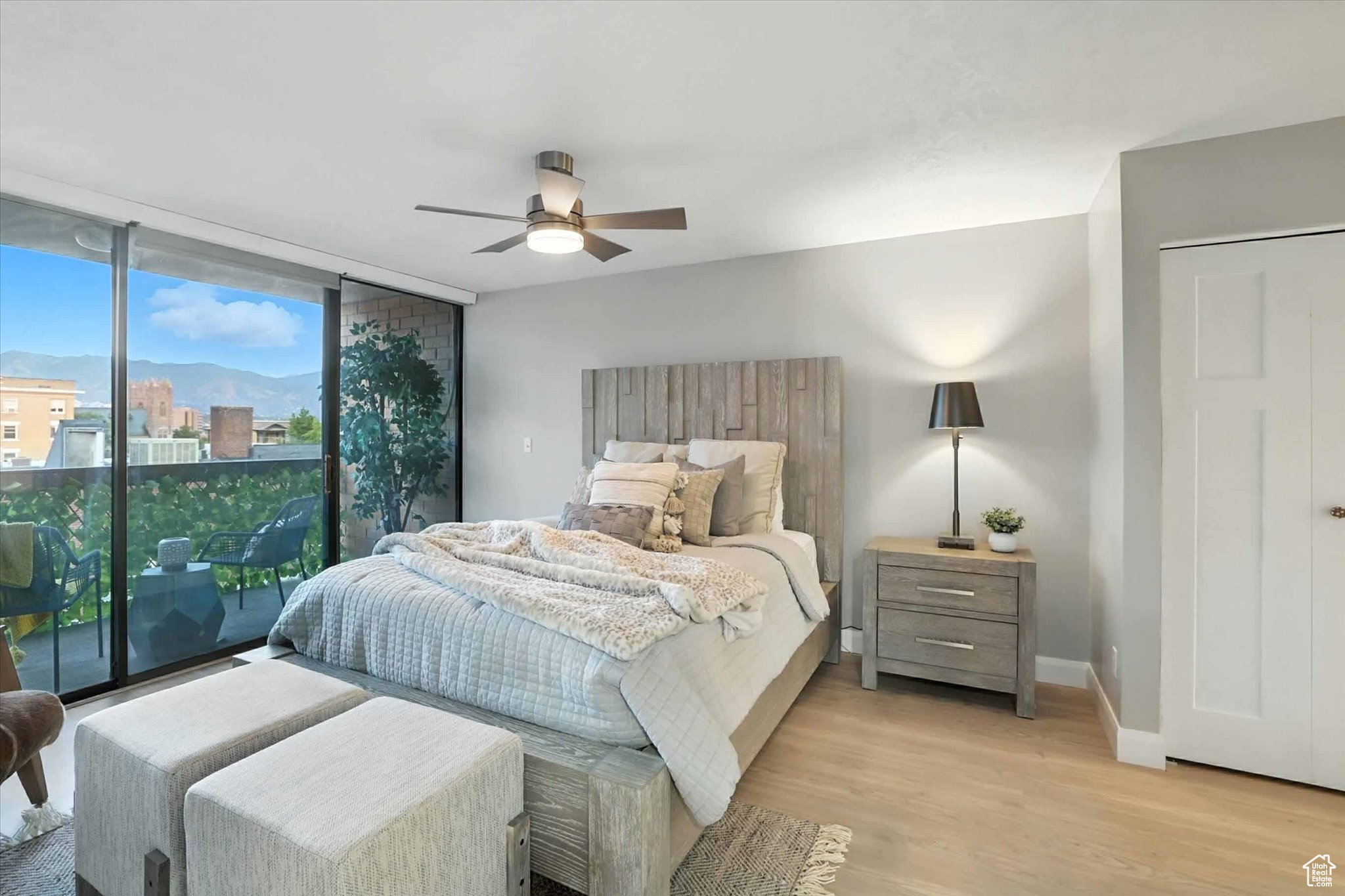 Bedroom suite on main floor with floor to ceiling windows with access to a private balcony with eastern mountain views.