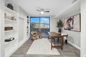 Home office with a built in shelves, and a mountain view with access to the roof top deck