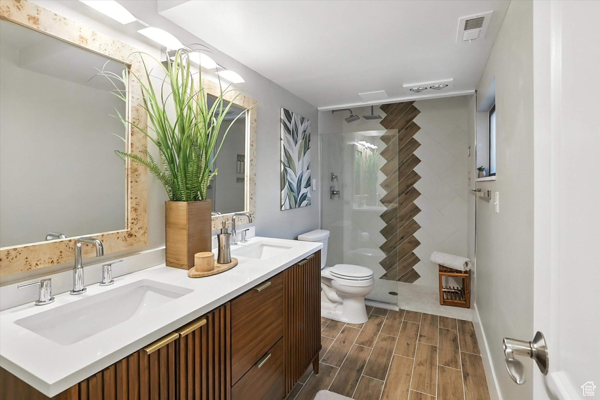 Top floor bathroom with double vanity and walk in shower