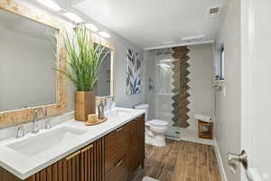 Top floor bathroom with double vanity and walk in shower