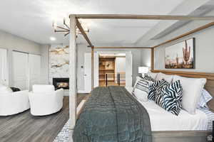 Top floor bedroom suite with a high end fireplace, wall of closets and access to the roof top deck