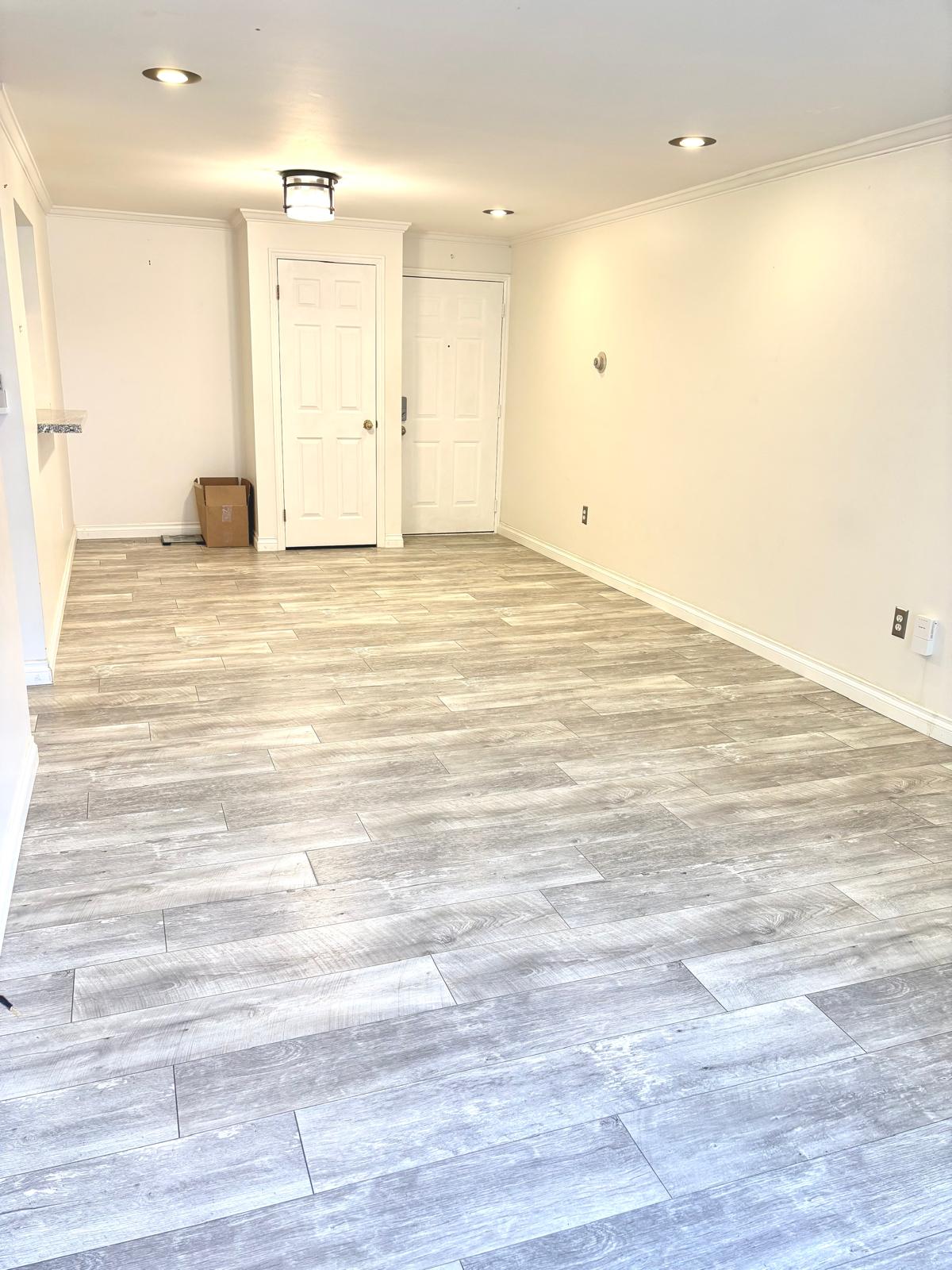 Unfurnished room with ornamental molding and light wood-style floors