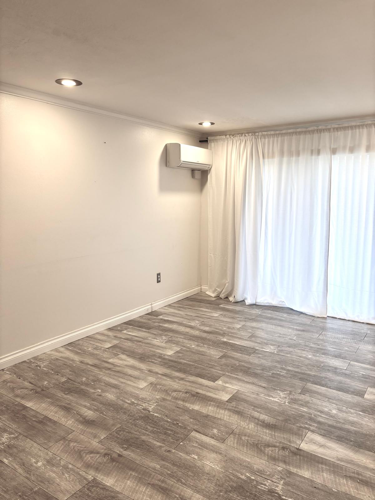 Empty room with crown molding, dark wood-style floors, and recessed lighting