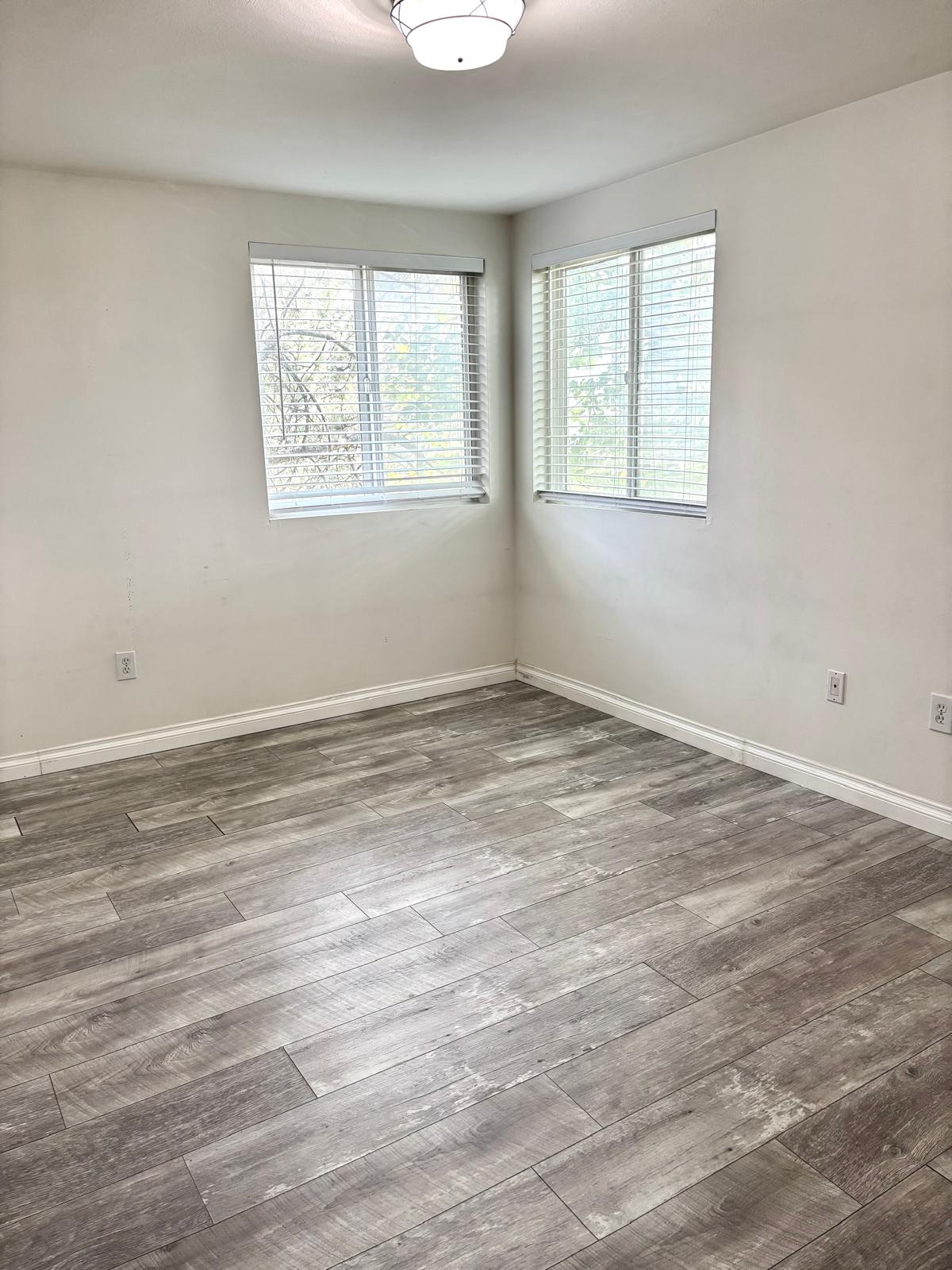 Unfurnished room with wood finished floors