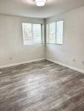 Unfurnished room with wood finished floors