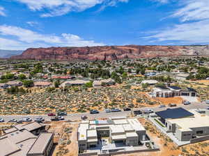 Aerial perspective of suburban area with a mountainous background