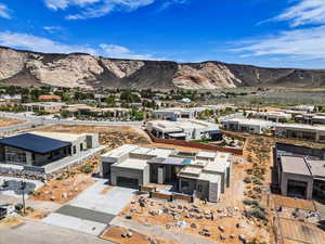 Aerial perspective of suburban area featuring a mountainous background