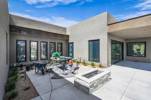 View of patio featuring a fire pit