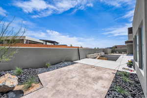 Fenced backyard featuring a patio