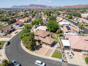 Aerial view of residential area featuring a mountainous background