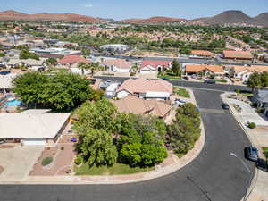 Aerial view of residential area featuring a mountain backdrop