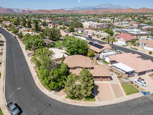 Aerial perspective of suburban area with a mountain backdrop
