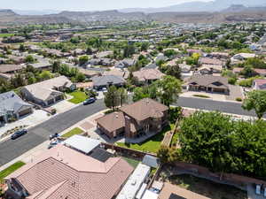 Aerial view of residential area featuring a mountainous background