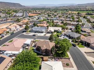 Aerial perspective of suburban area with a mountainous background