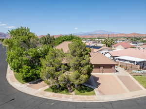Aerial perspective of suburban area featuring a mountain backdrop