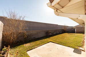 View of fenced backyard