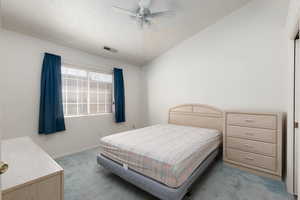 Bedroom featuring light colored carpet and a ceiling fan