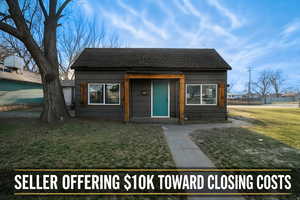 Bungalow-style home with a shingled roof