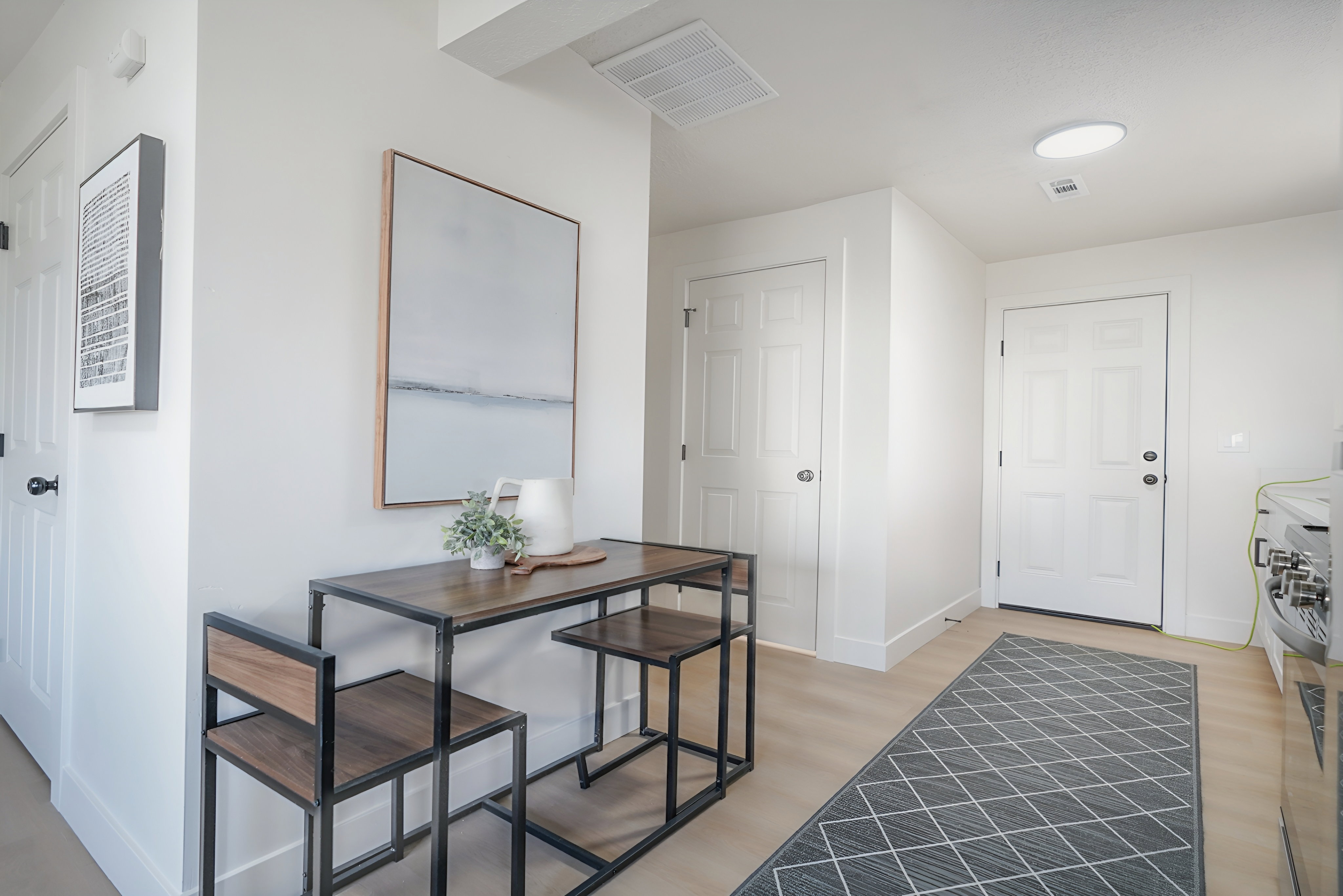 Foyer with light wood-style flooring and baseboards