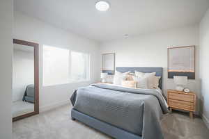 Carpeted bedroom with baseboards