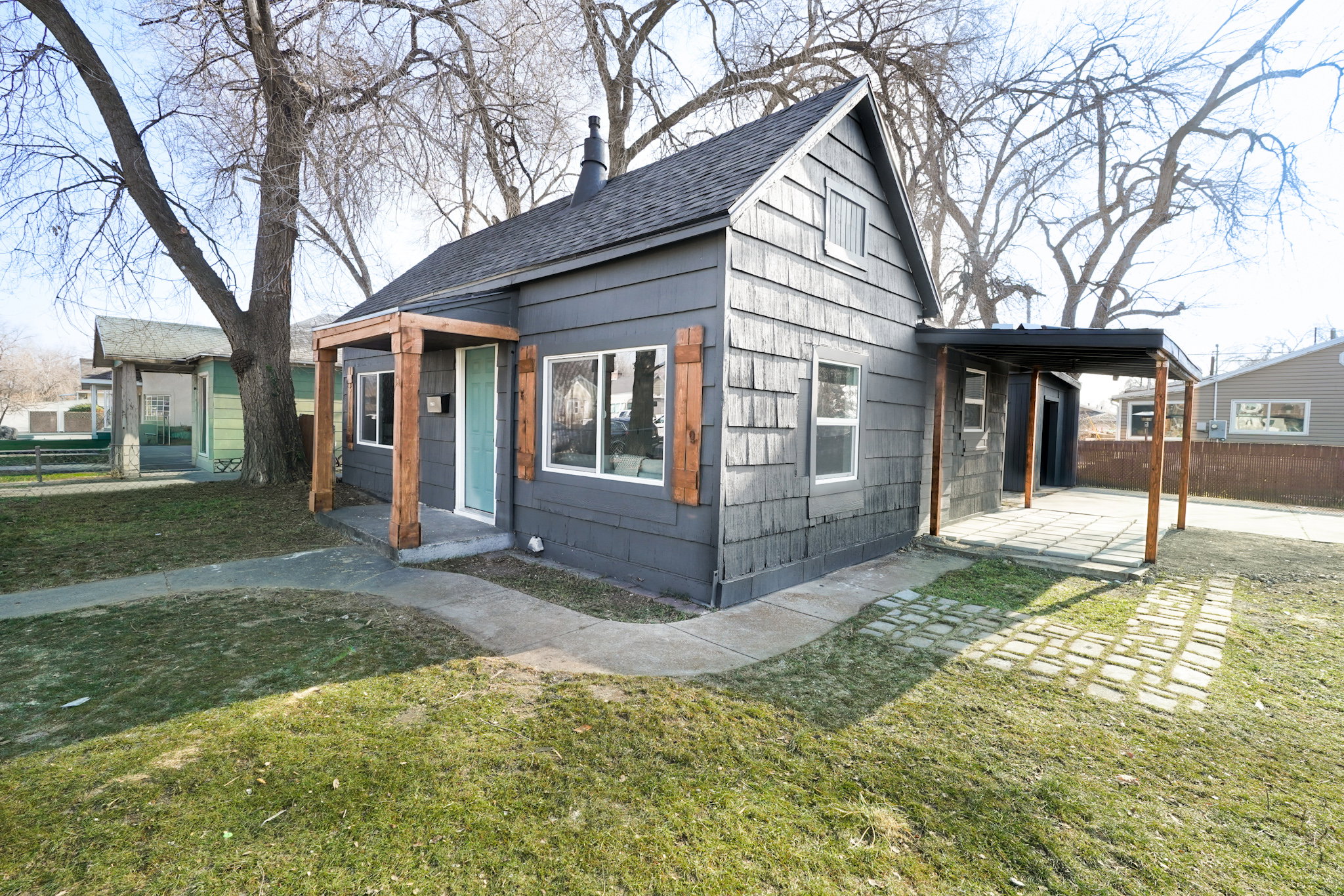 View of front facade featuring roof with shingles