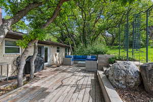 Deck featuring outdoor seating and grilling area