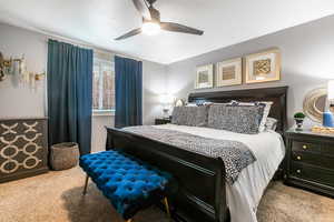 Bedroom featuring carpet and a ceiling fan