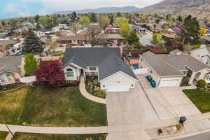 Aerial perspective of suburban area with a mountainous background