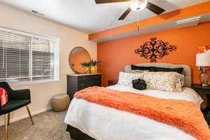 Carpeted bedroom with baseboards and ceiling fan